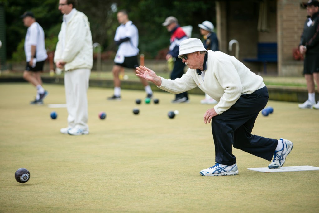 Lawn Bowls player rowling bowl