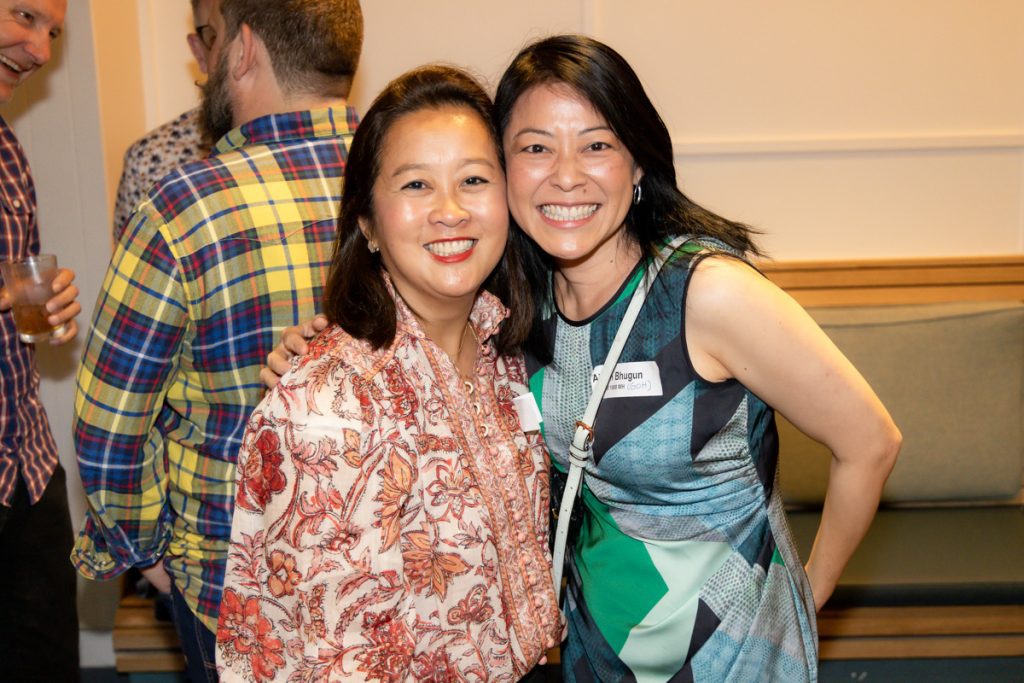 a couple of women standing next to each other