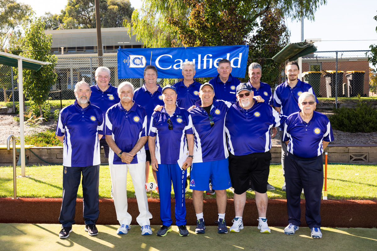 a group of people standing next to each other at APS Past Students Lawn Bowls Tournament