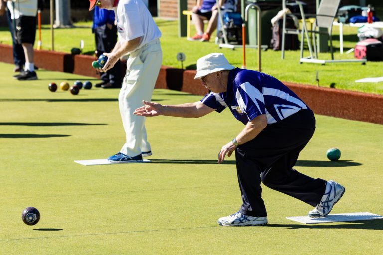 a group of men playing a game of bowling at APS Past Students Lawn Bowls Tournament