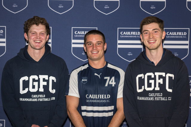 a group of Football boys standing next to each other.