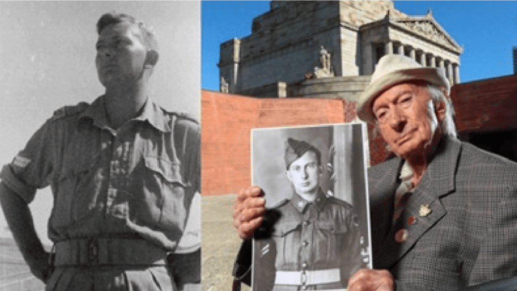 Geoff Pullman holding a picture of a soldier