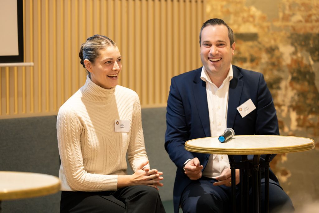 a man and a woman sitting next to each other at Reverse Mentoring program
