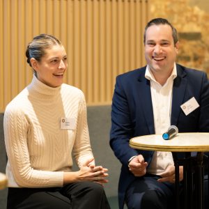 a man and a woman sitting next to each other at Reverse Mentoring program