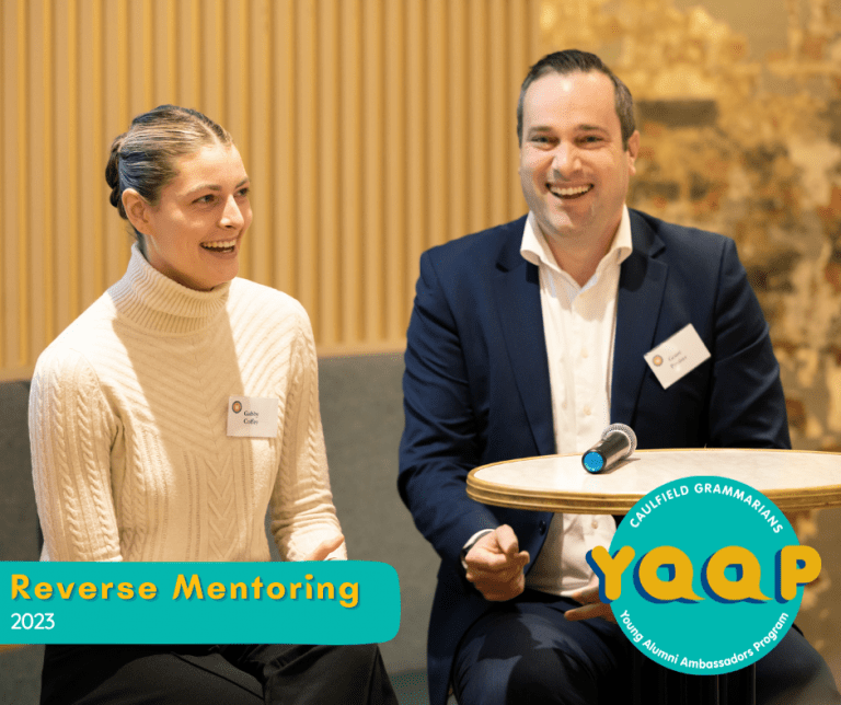 a man and a woman sitting next to each other at Reverse Mentoring program