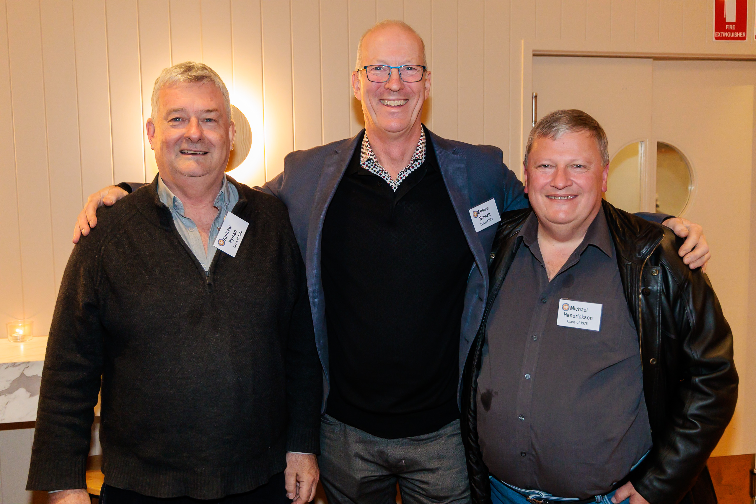a group of three men standing next to each other at Class of 1978 & 1983 Reunion